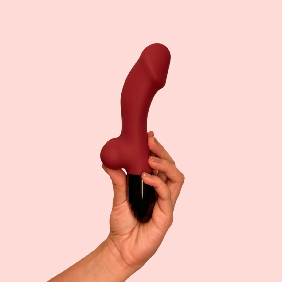 Vibrador Yema Escarlata en vista de perfil mostrando brote redondeado en la base y acabado de la carcasa - Edén