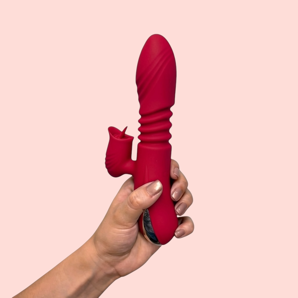 Vibrador Brote de Magdala variante color vino con brazo estimulador, sostenido en la mano - Edén